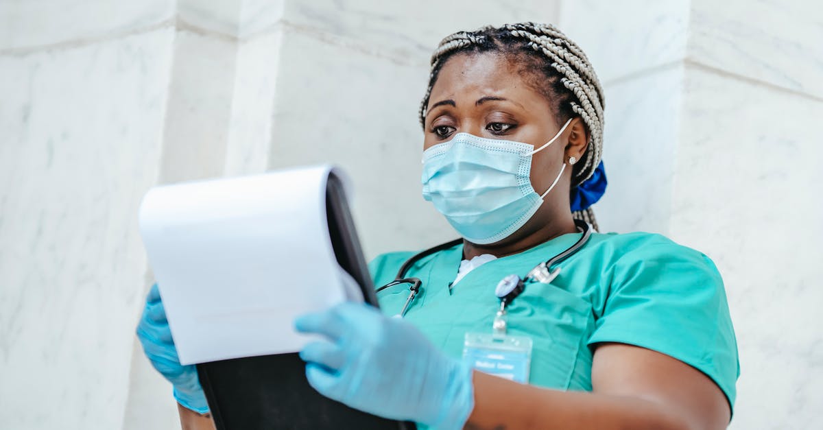 How to get uniform sized biscotti? - Attentive mature African American female medic in uniform with stethoscope and clipboard against wall at work