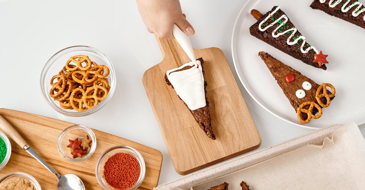 How to heat frozen stuffed pretzels other than bake them - Top View of a Person Decorating a Triangle Shaped Cake