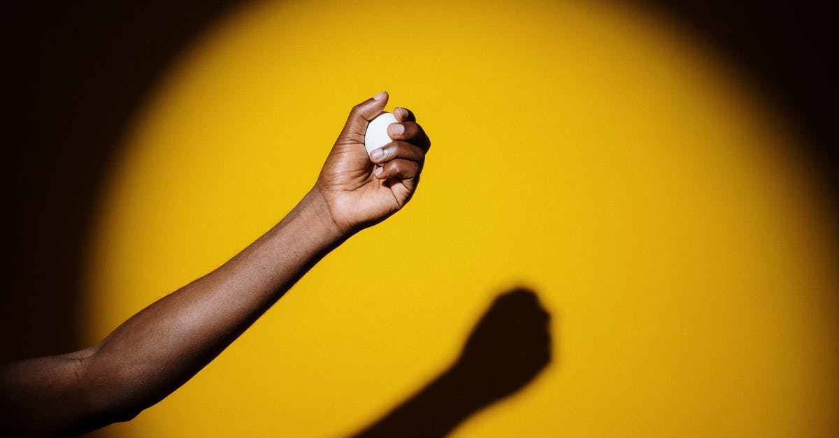 How to hold and then poach egg yolks? - Photo Of Person Holding Egg