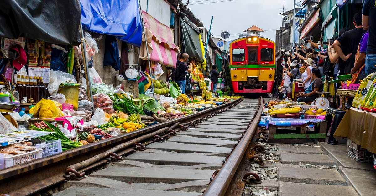 How to keep fruits and vegetables fresh - Mae Klong train market in Samut Songkhram, Thailand