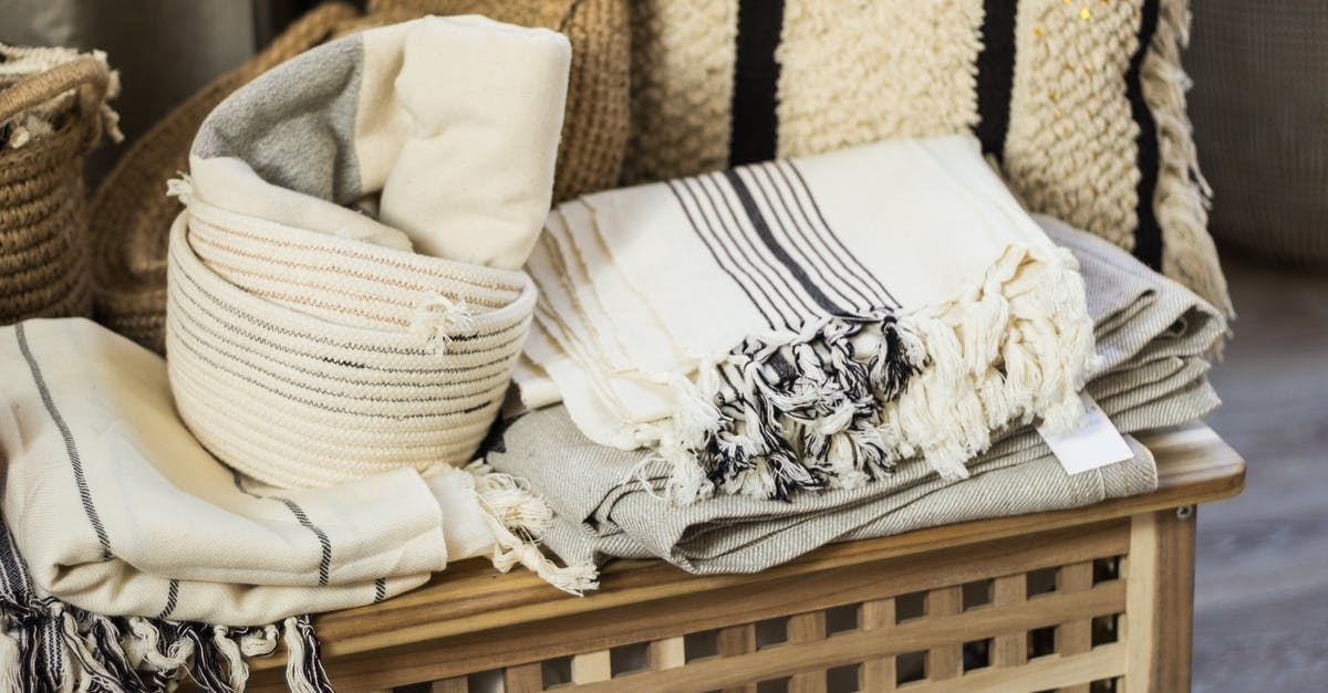 How to keep profiteroles fresh - Stacked towels and plaid on wooden box