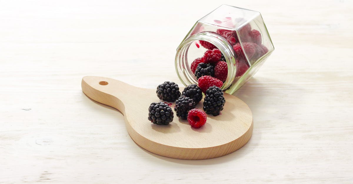 How to know if blackberries are safe to eat? - Clear Glass Bottle With Raspberries Inside