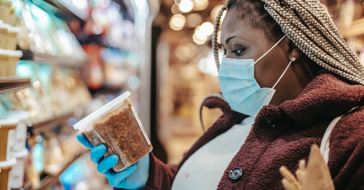 How to know if frozen clams are good when cooked - Black woman checking ingredients and manufacturing date of product