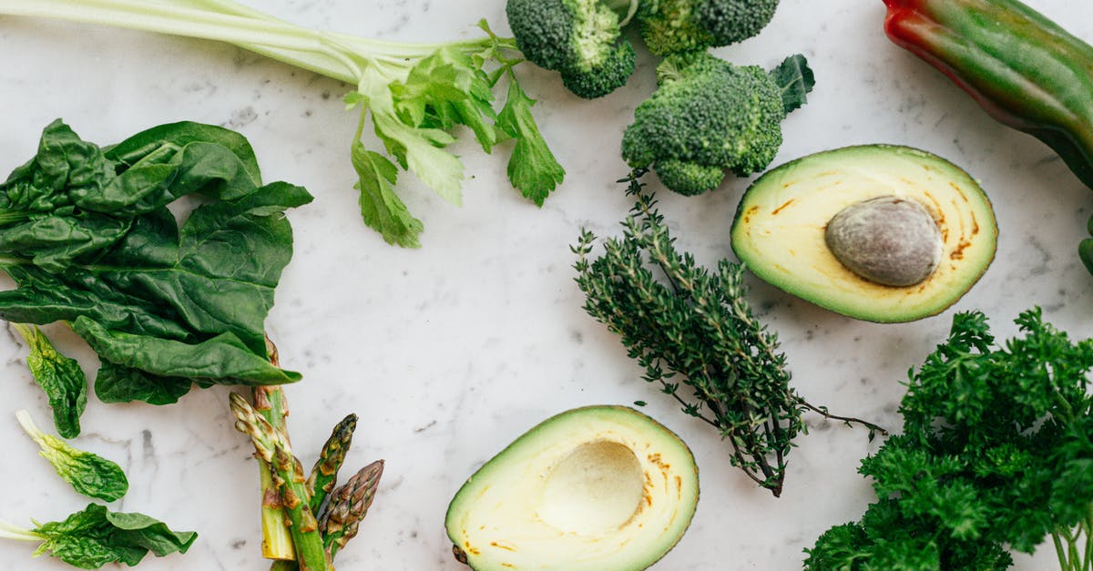 How to know when spinach has gone bad? - Sliced Avocado Fruit and Green Vegetable on White Chopping Board