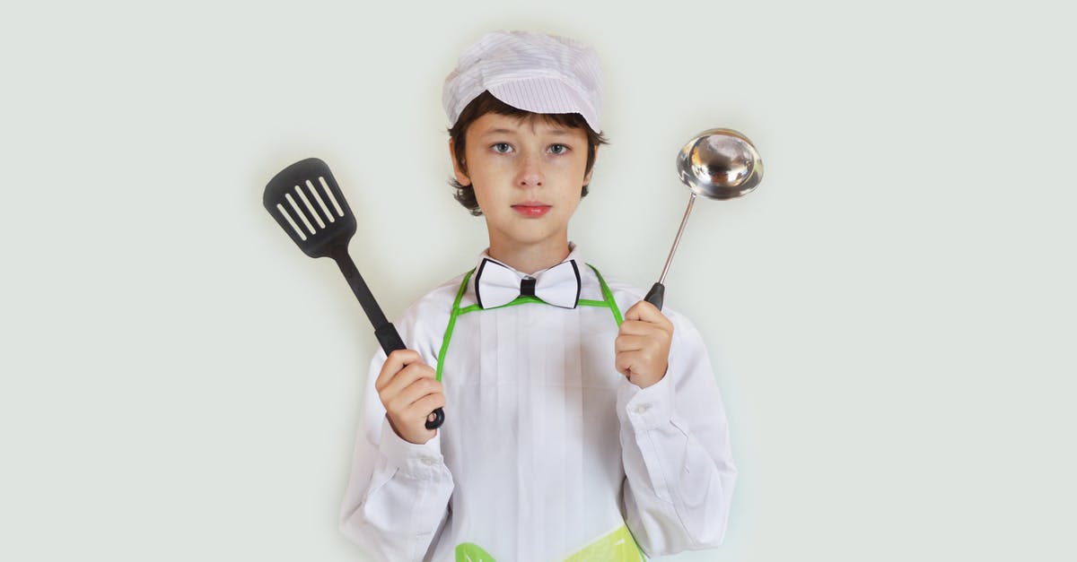 How to learn to cook? [duplicate] - Positive preteen boy in apron and chef hat demonstrating utensils and looking at camera against white wall in studio