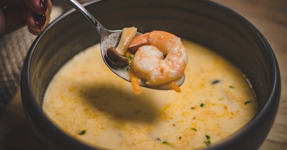 How to make a restaurant style meatless Hot and Sour Soup - Bowl of Shrimp Soup on Brown Wooden Surface