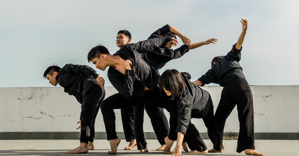 How to make black peppercorns extremely fine? - Six People in Black Matching Clothes Dancing at Daytime