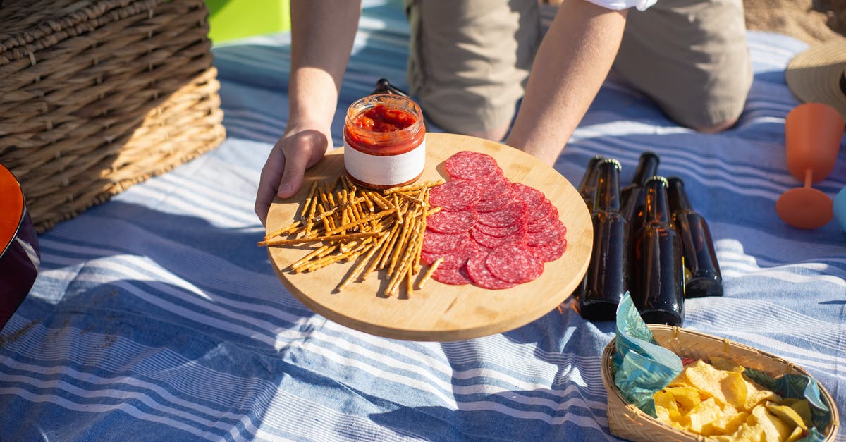 How to make chunky salsa like supermarket jarred salsa? - A Person Holding a Wooden Board with Foods