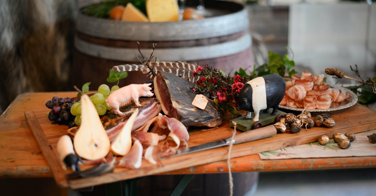 How to make extremely dry pork more palatable? - Delicious meat appetizers with fruits on wooden desk