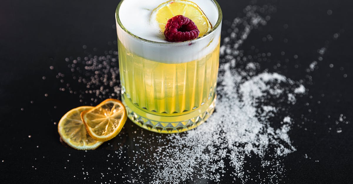 How to make lemon powder using lemon juice like milk powder? - Clear Drinking Glass With Yellow Liquid and Sliced Lemon