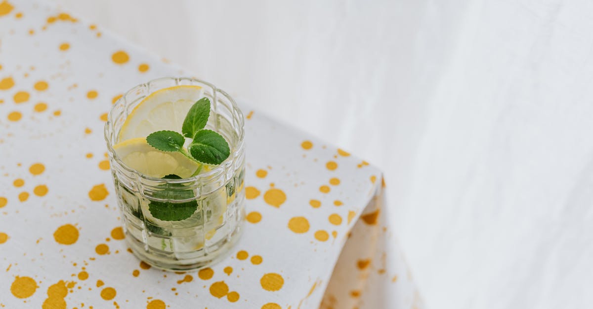 How to make mint syrup with minimum water? - Glass of fresh cocktail on corner of table