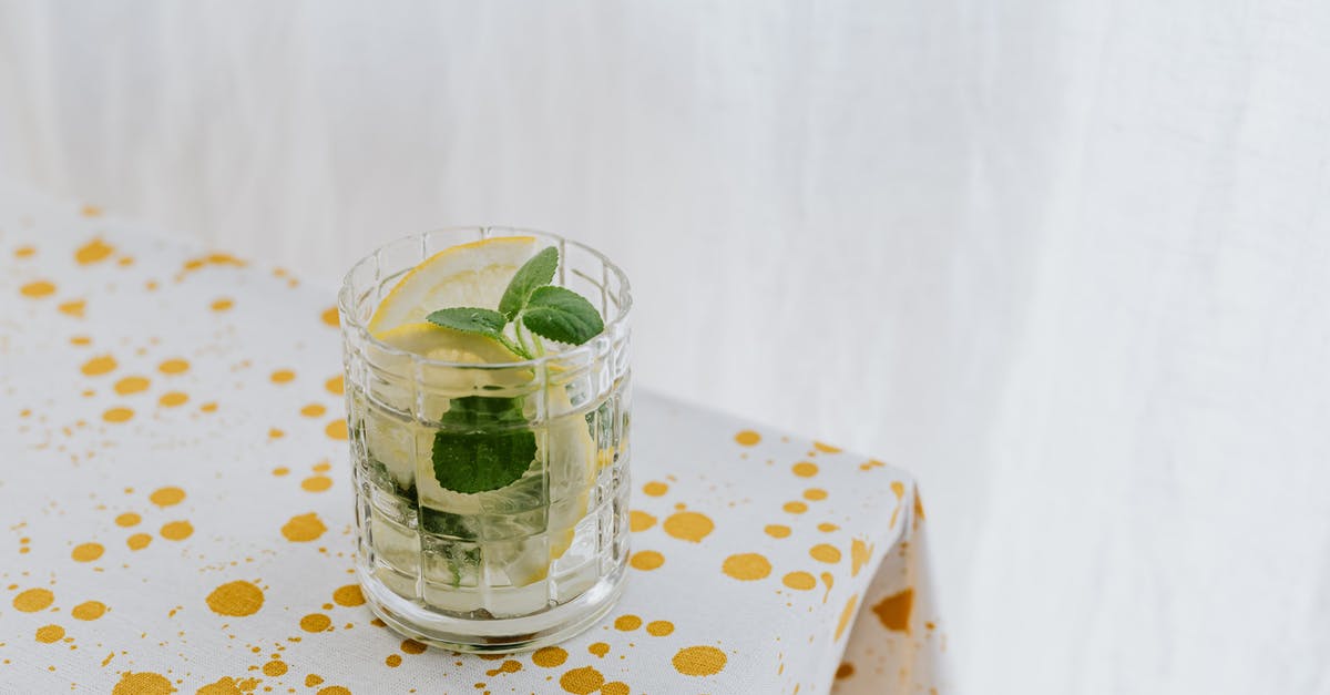 How to make mint syrup with minimum water? - Glass of fresh cocktail on table