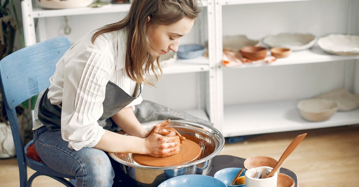 How to make potato wheel not stick to mold - Woman forming clay bowl on pottery wheel