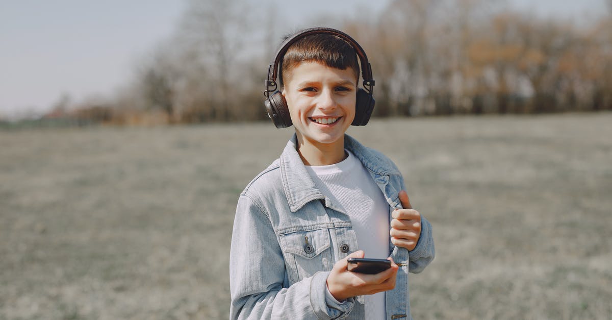 How to make "white" jello using aloe vera jelly pack for broken glass dessert - Happy smiling boy in jean jacket listening to music in headphones on smartphone while spending time in countryside at daytime