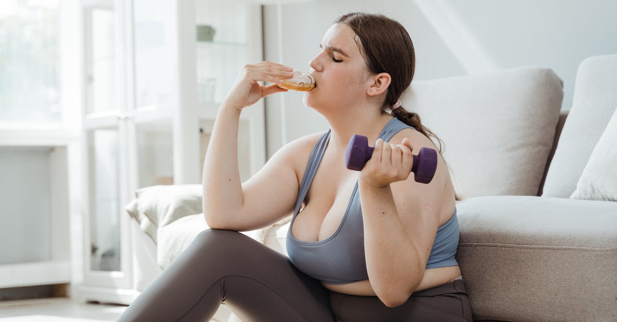 How to make raspberry donut filling [closed] - Woman in Blue Sports Bra and Gray Leggings Sitting on Couch