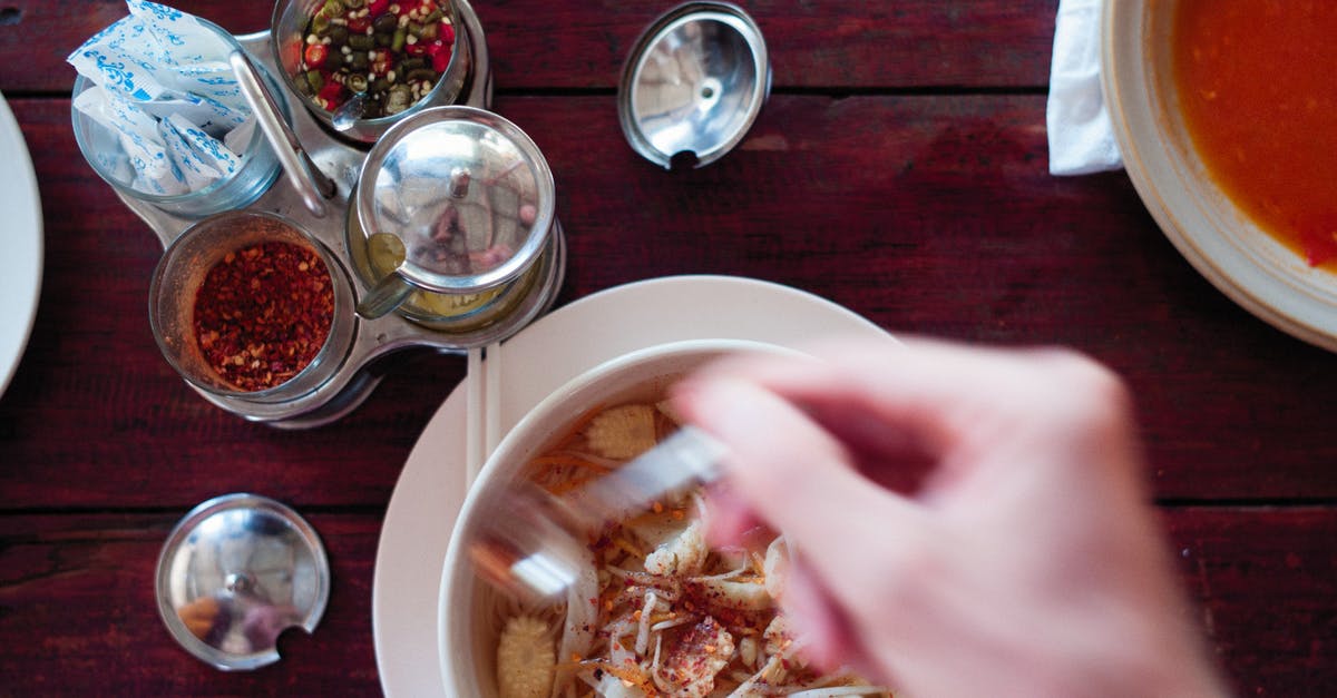 how to make soup less 'meaty'? - Person Holding White Ceramic Bowl With Food