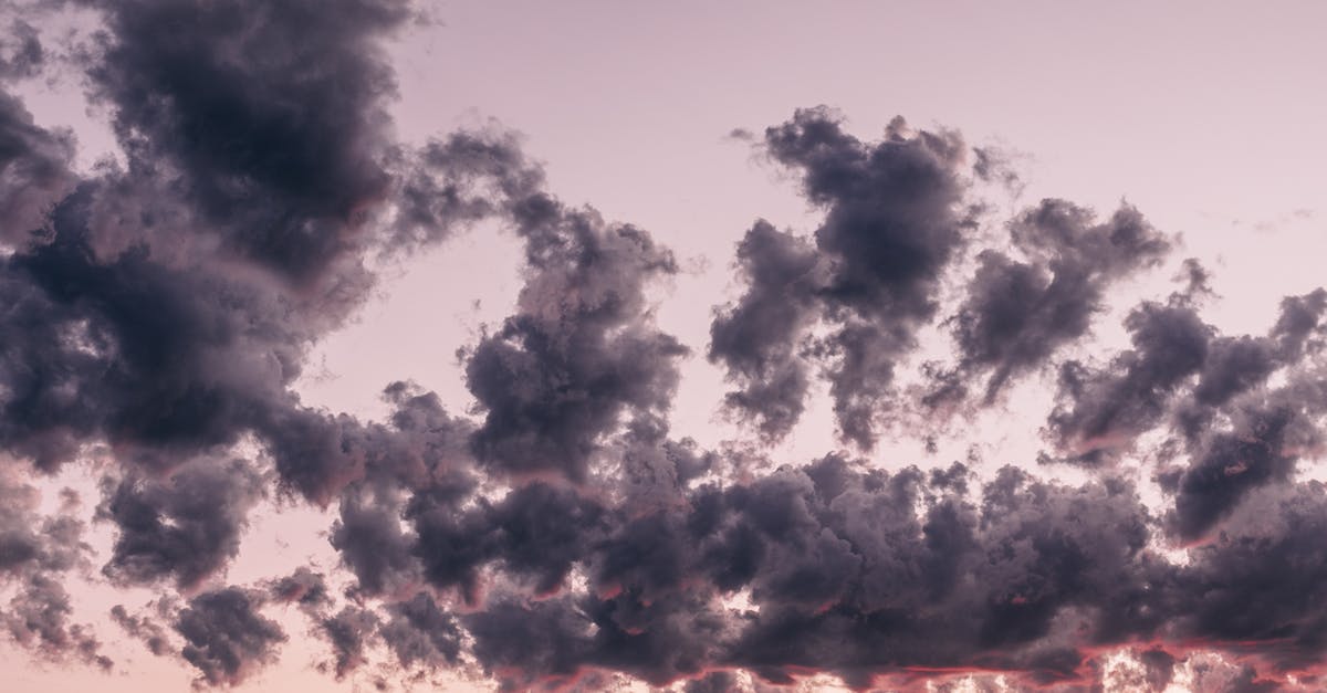 How to make thick and fluffy pancakes? - From below of dark fluffy clouds floating in sky in summer evening at sundown