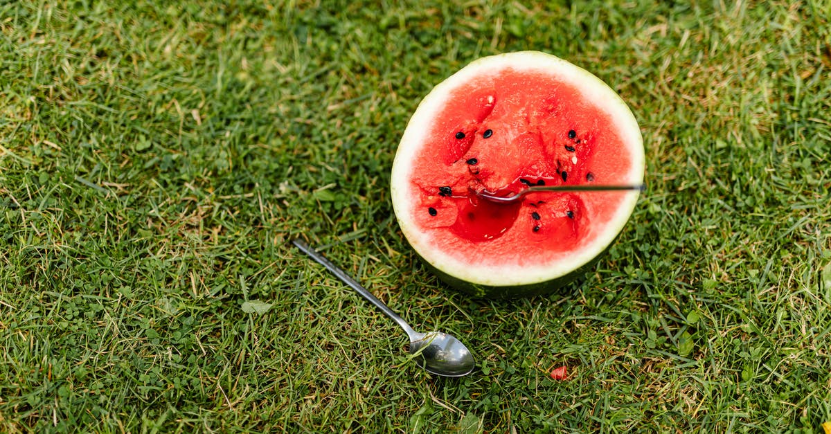 How to make XXL Watermelon Jell-O Shots without falling apart? - Sliced Watermelon with Spoon on the Grass