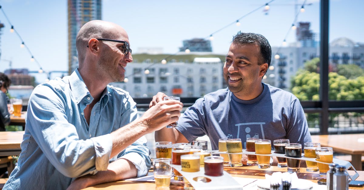 How to Pair for Beer Tastings - Two Men Drinking Outside Restaurant