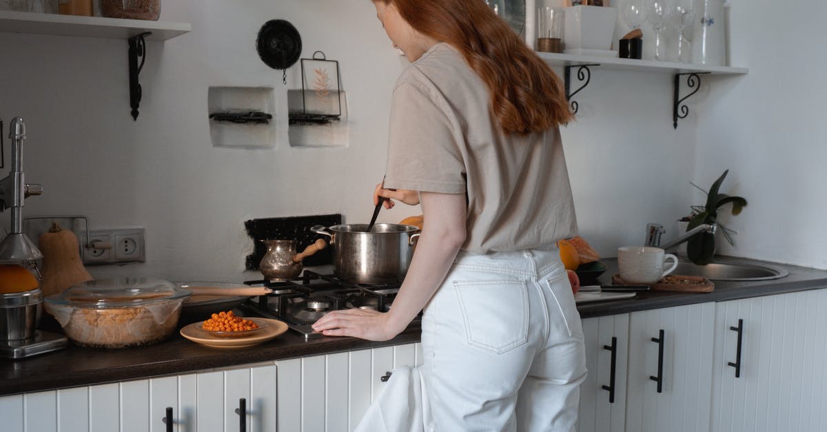 How to parcook a casserole? - Woman in Brown Shirt and White Pants Standing in Front of Stove