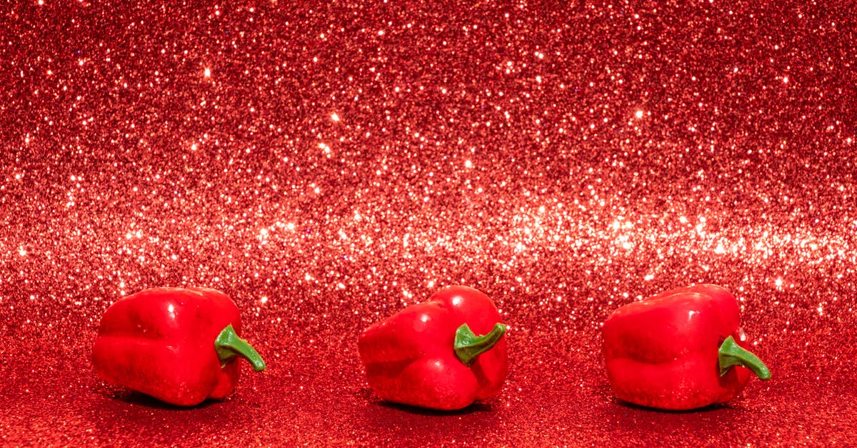 How to peel bell peppers effectively? - Three Red Bell Peppers on Red Surface