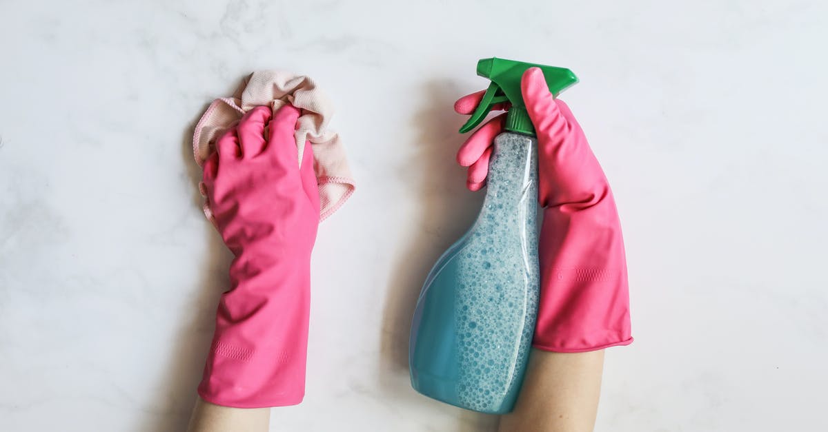 How to prep a #5 plastic container for making yogurt? - A Person Cleaning Using Cleaning Products