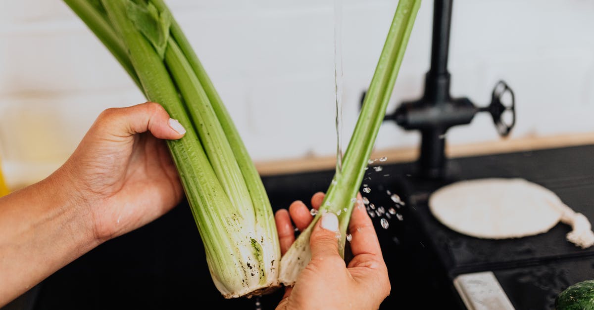 How to prepare celery for dipping? - Woman Washing Celery in Kitchen 