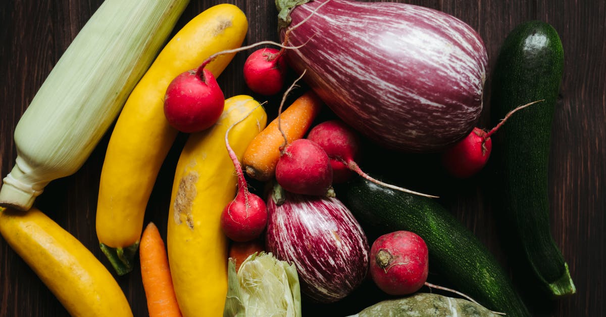 How to prepare courgettes/zucchini? - Fresh colorful vegetables on table