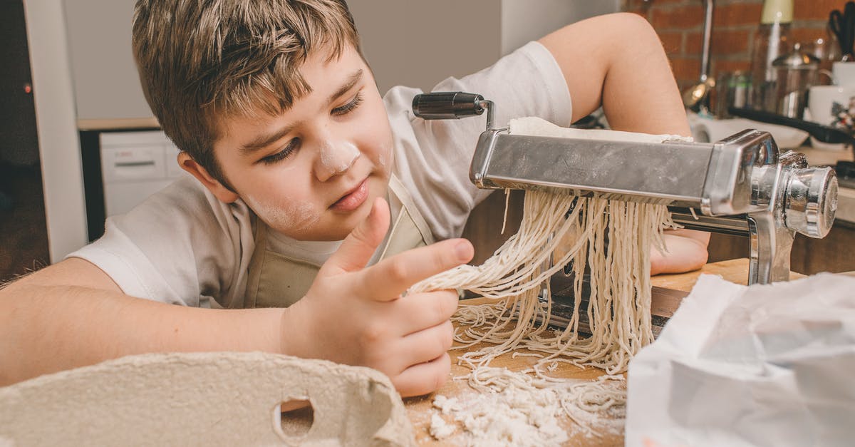How to prepare shirataki noodles to more closely resemble classic pasta? - A Boy Looking at Fresh Pasta Noodles at a Pasta Maker