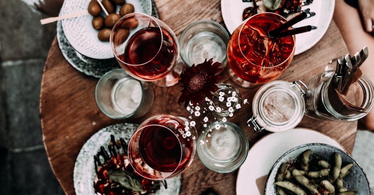 How to preserve fermented bean sauce - Anonymous person near table with glasses and meals