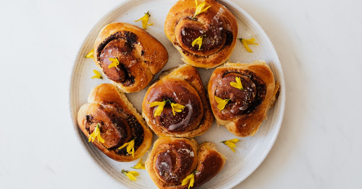 How to prevent brillant pink raw bread dough from cooking up to yellow? - Baked Cinnamon Rolls on White Plate with Yellow Flowers