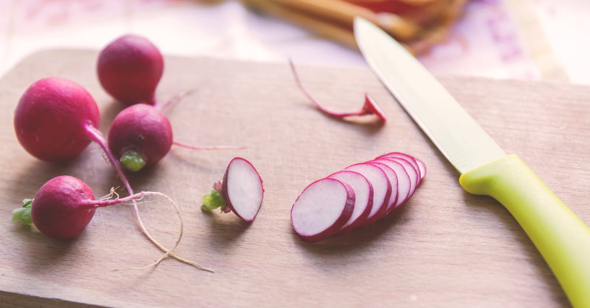 How to prevent sliced vegetables/roots from sticking to the blade - Green and Silver Kitchen Knife Beside Pink Onions