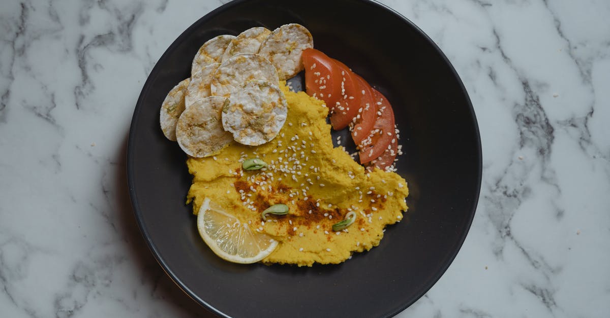 How to prevent sliced vegetables/roots from sticking to the blade - A Hummus with Sliced Tomatoes on the Side