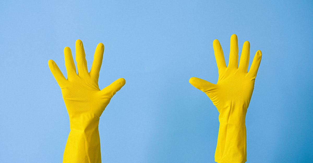 How to prevent the lasagne filling from sliding out? - Crop unrecognizable person in rubber gloves raising arms