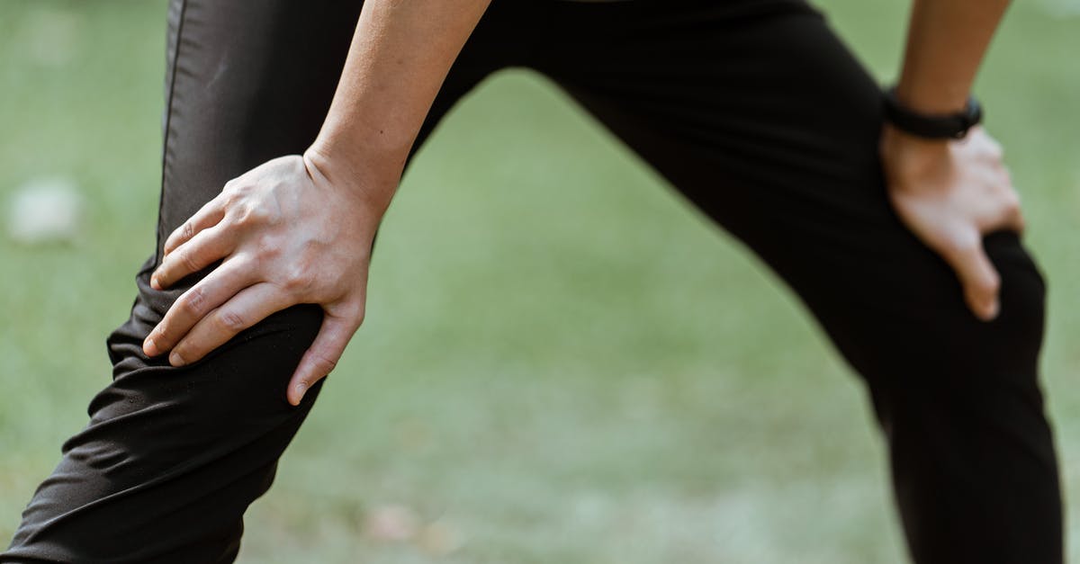 How to recover a cast-iron pot? - Crop sportsperson resting after training on lawn