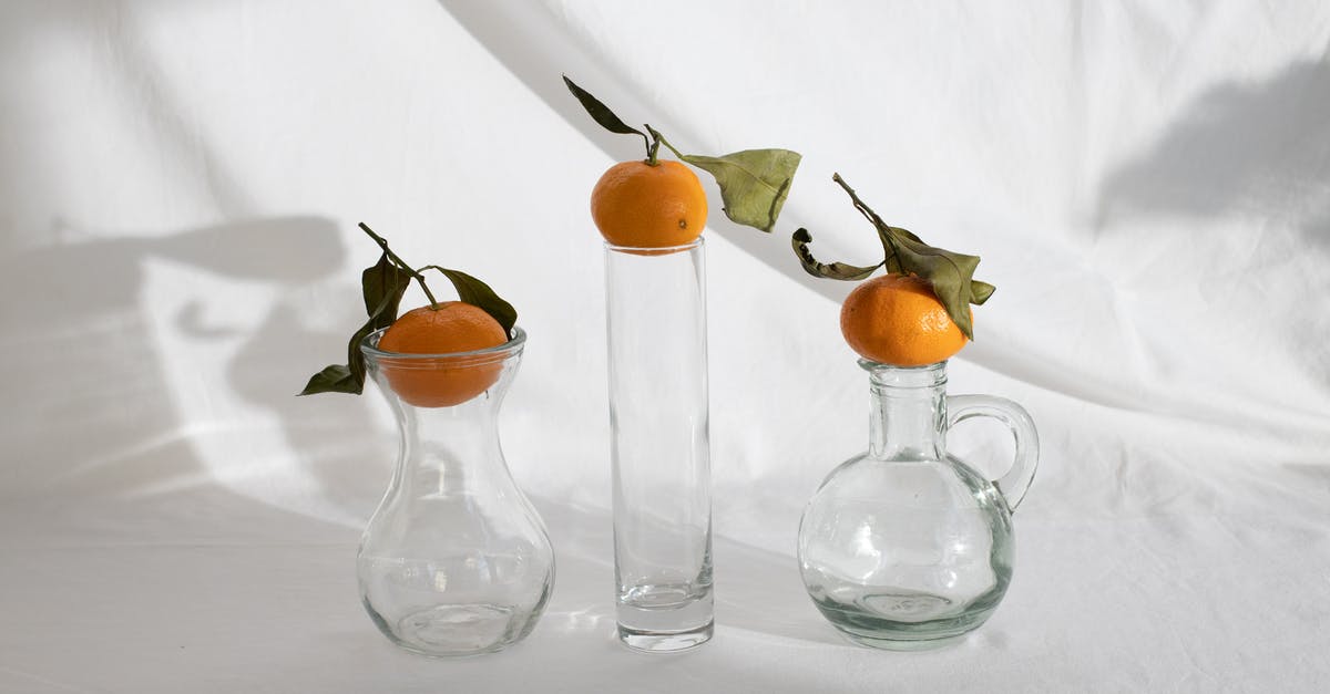 How to reduce or eliminate the flavor of orange in a stew? - Delicious mandarins placed on vases on white background