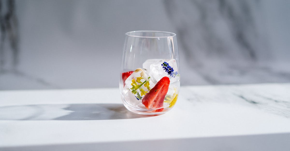 How to reduce the sourness of homemade frozen yogurt? - Clear Drinking Glass With Red and White Liquid