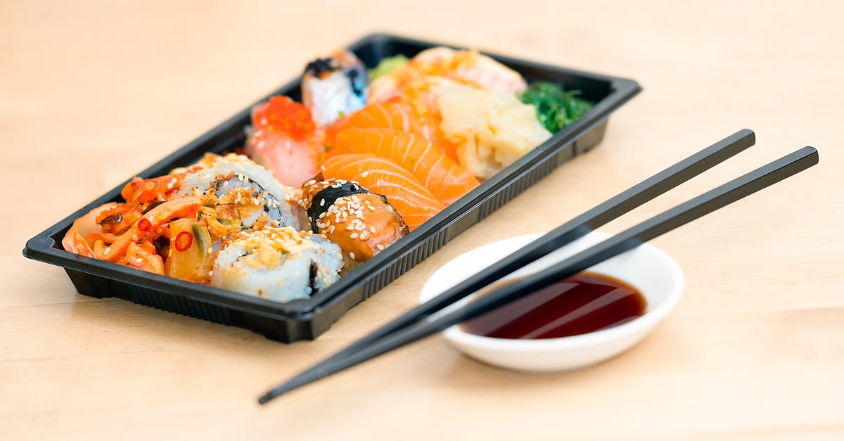 How to reduce/remove smell when cooking salmon fin soup? - Close-up Photo of Sushi Served on Table