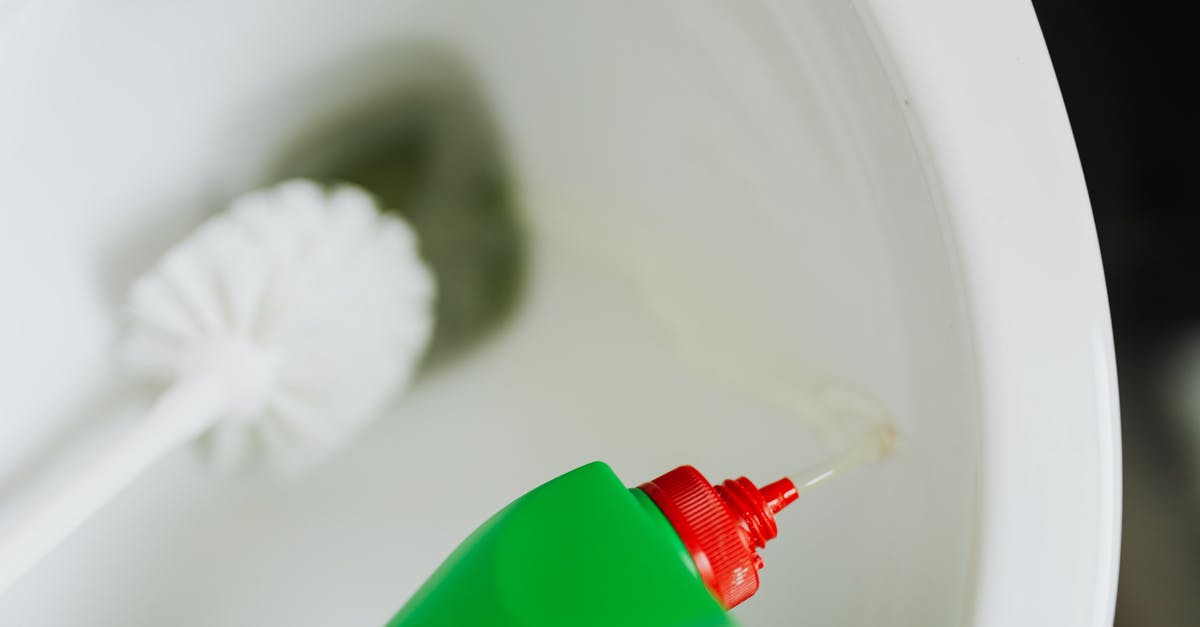 How to remove smell from plastic lid? - Liquid toilet cleaner pouring in toilet bowl