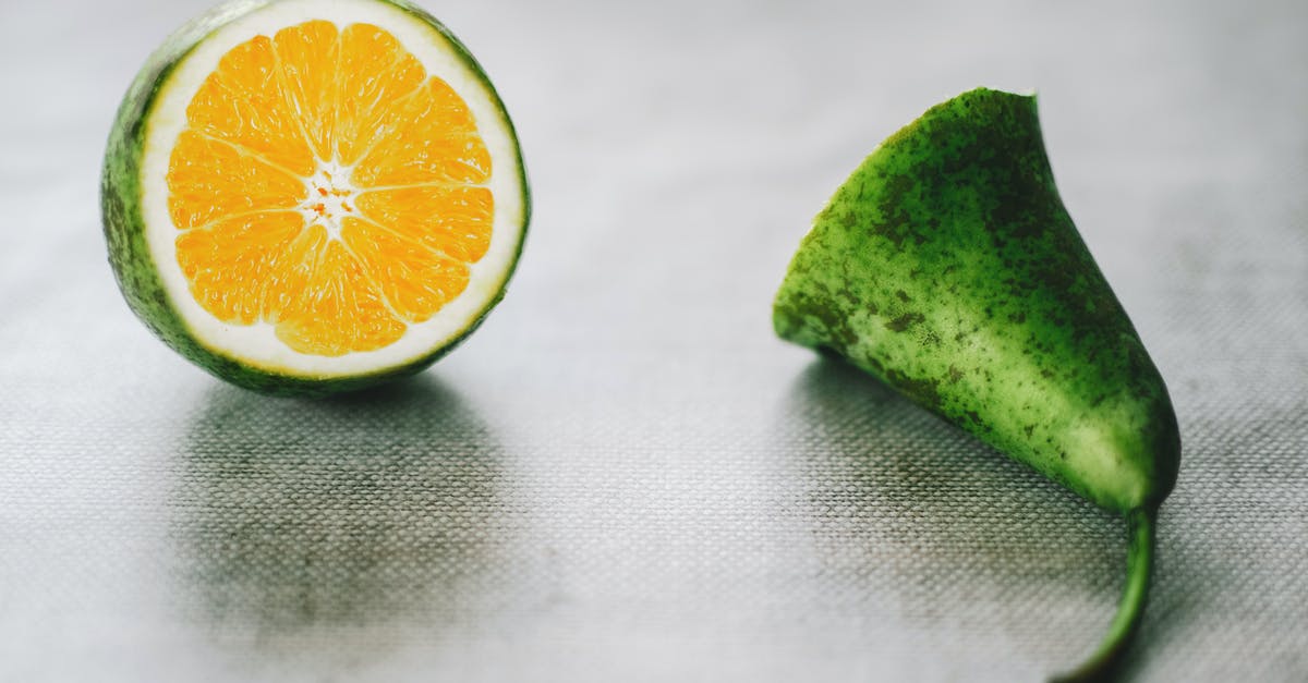 How to remove the rind from Citrus Sugar? - Green Citrus Fruit on Gray Surface