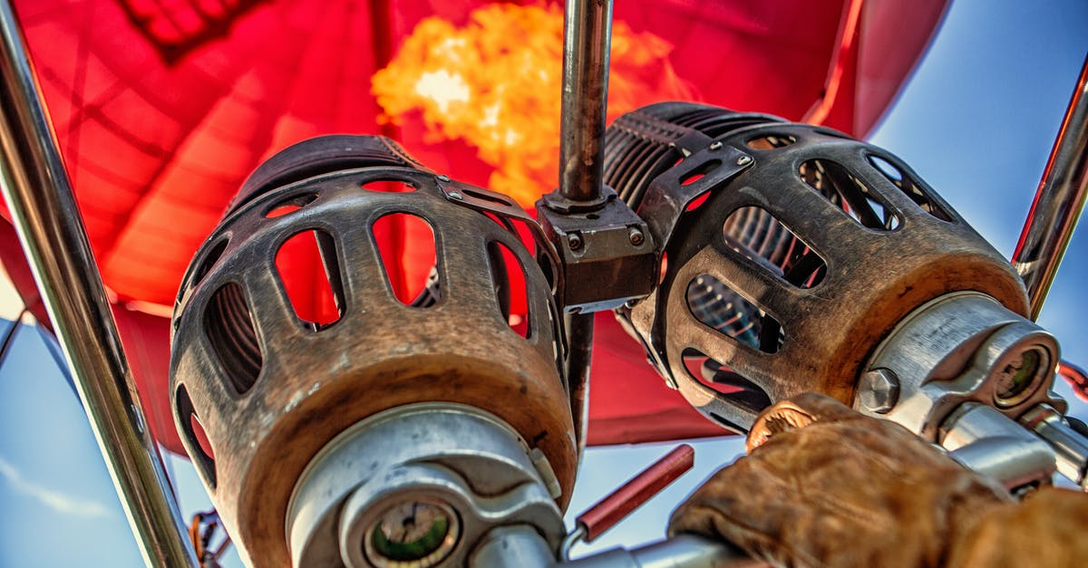 How to reseason cast iron skillets using a fire - Red Hot Air Balloon Photo