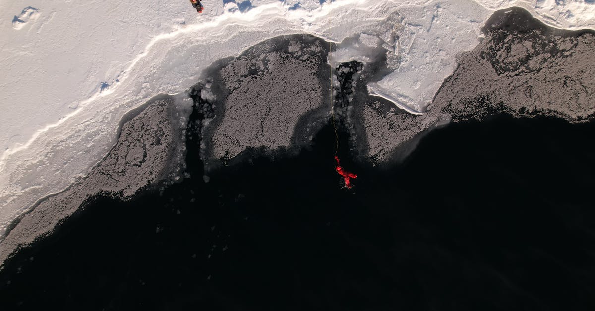 how to season a frozen steak - A Man in Red Wet Suit Swimming on Frozen Lake