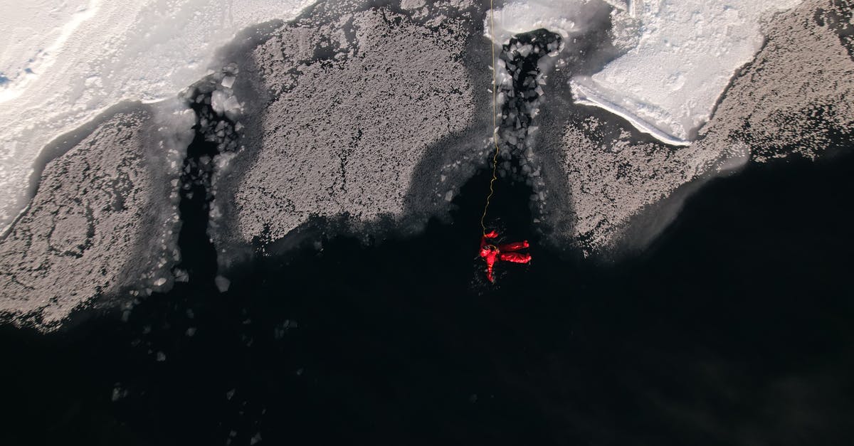 how to season a frozen steak - A Man in Red Wet Suit Swimming on Frozen Lake