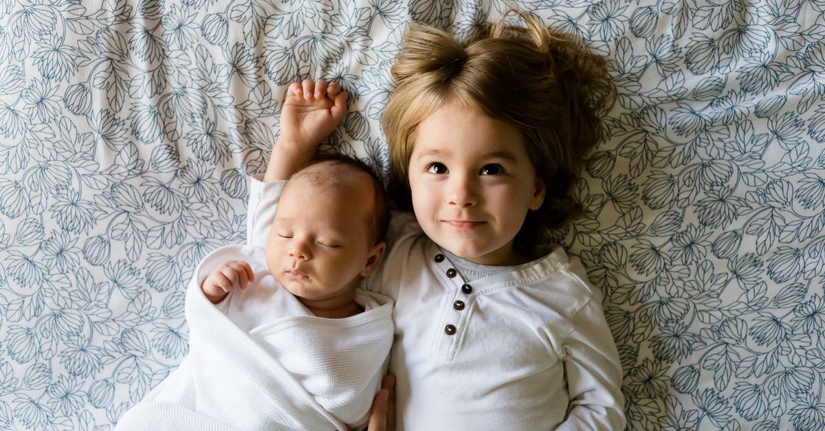 How to separate two jammed-together measuring cups? - Baby Sleeping Beside Girl on Gray Floral Textile