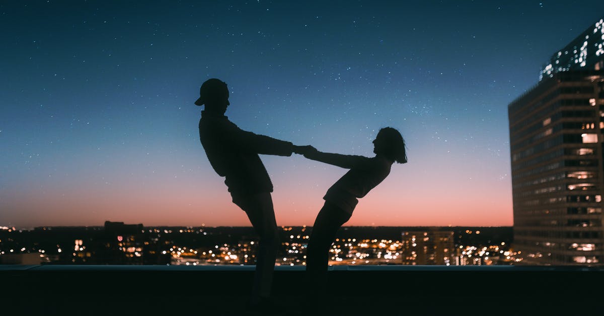 How to separate two jammed-together measuring cups? - Silhouette of Man Jumping on Field during Night Time