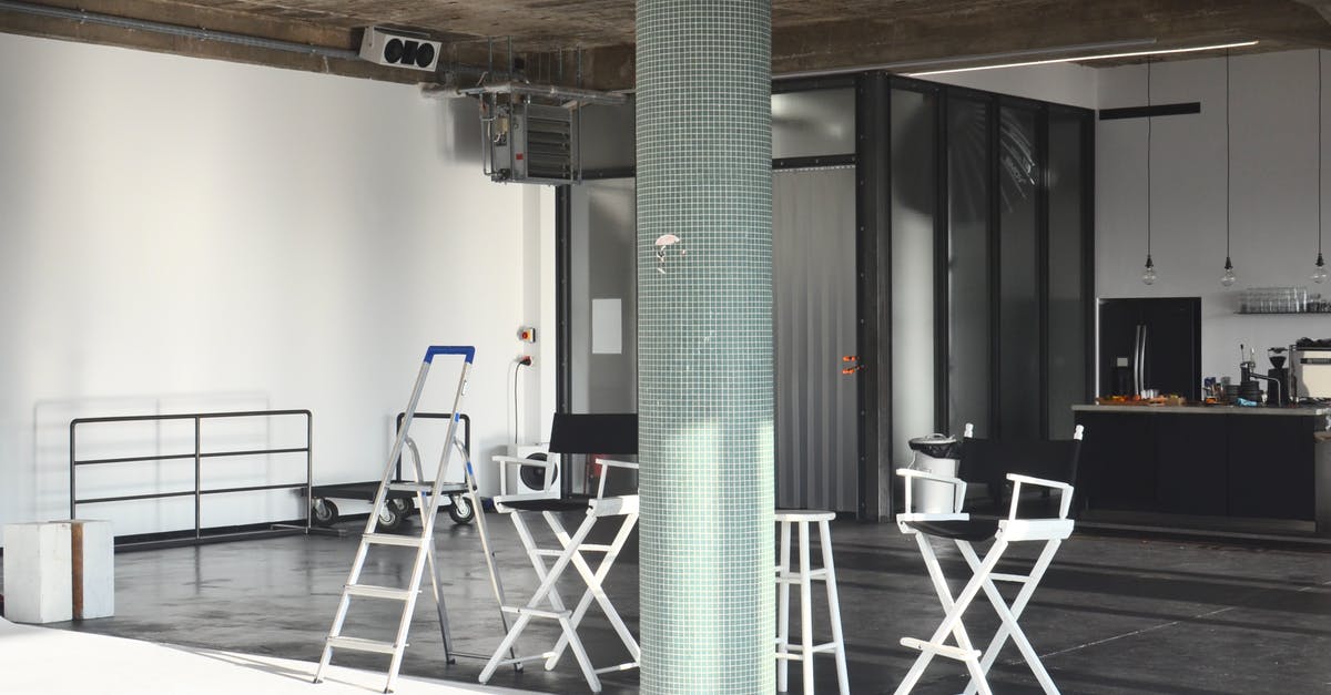 How to set the temperature in a refrigerator without proper indication on the dials? - Interior of modern studio with chairs and kitchen furniture How to set the temperature in a refrigerator without proper indication on the dials? - Interior of modern studio with chairs and kitchen furniture