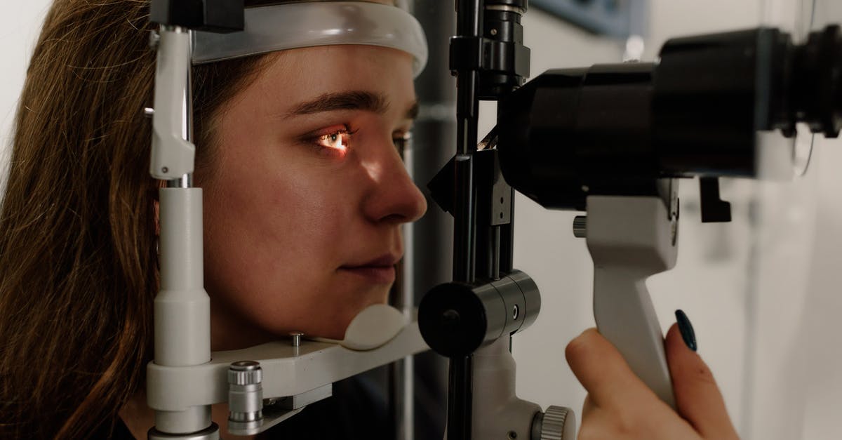 How to shell macadamias without a special tool? - Woman testing vision on microscope