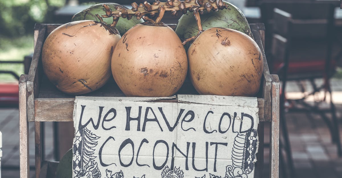 How to shop for a food processor capable of pulverizing plant material to a fine powder? - Tan Coconuts Placed Atop Brown Wooden Table