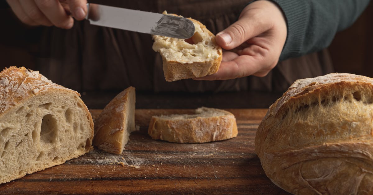 How to spread peanut butter that is required to stay refrigerated? - A Person Putting Butter on Bread