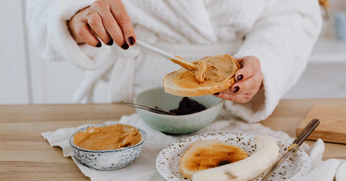 How to spread peanut butter that is required to stay refrigerated? - Person Spreading Peanut Butter on Toast 